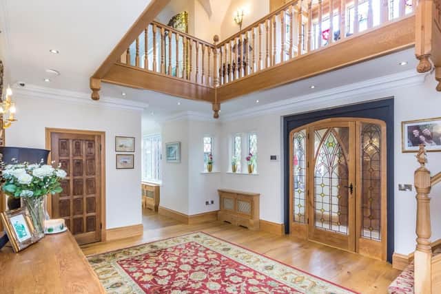 The entrance hall features a hand-built oak staircase with Barley Twist spindles.