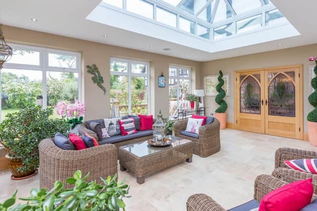 Impervious to the cold, the orangery has a travertine floor with underfloor heating.