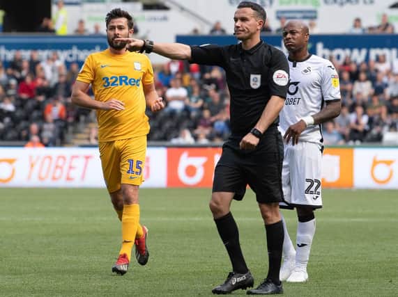 Referee Dean Whitestone awards Preston  a penalty for Swansea City's Connor Roberts foul on Sean Maguire