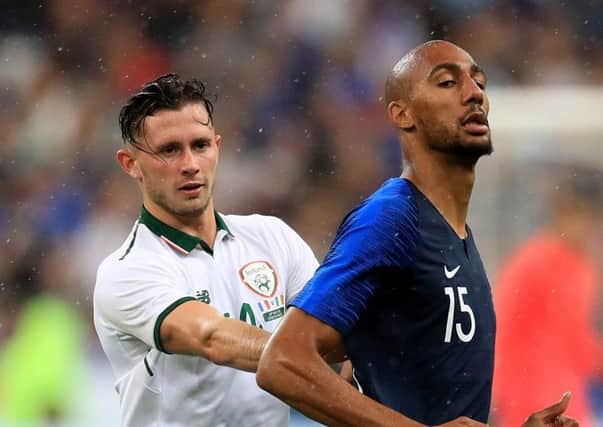 Alan Browne with France's Steven Nzonzi (right) in Paris on Monday