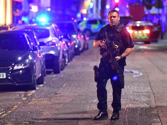 An armed police officer on the night of the London Bridge terrorist attack (Picture: Dominic Lipinski/PA Wire)