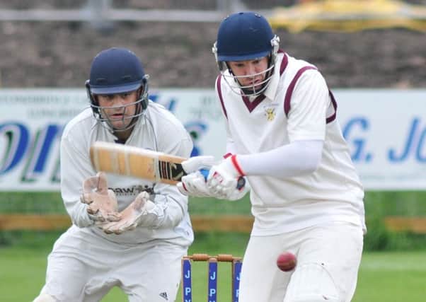 Eccleston's Michael Atkinson faces a delivery, watched by Longridge wicketkeeper Kyle Helm