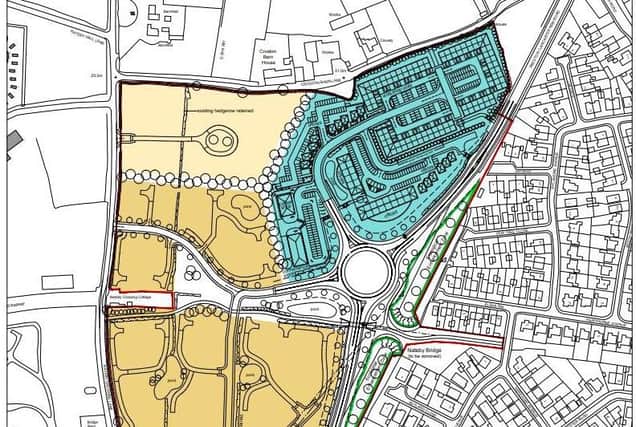 Part of the proposed complex, with residential properties in the yellow and business and retail units in the turquoise.