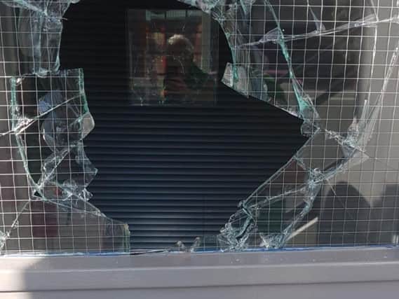 Intruders gained access by smashing their way through a glass panel