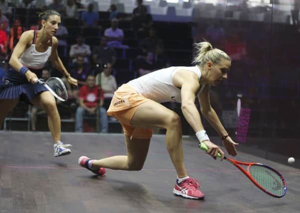 Laura Massaro returns a shot from Camille Serme of France