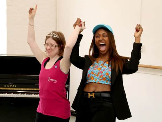 DanceSyndrome founder Jen Blackwell celebrates with singer Alexandra Burke in London