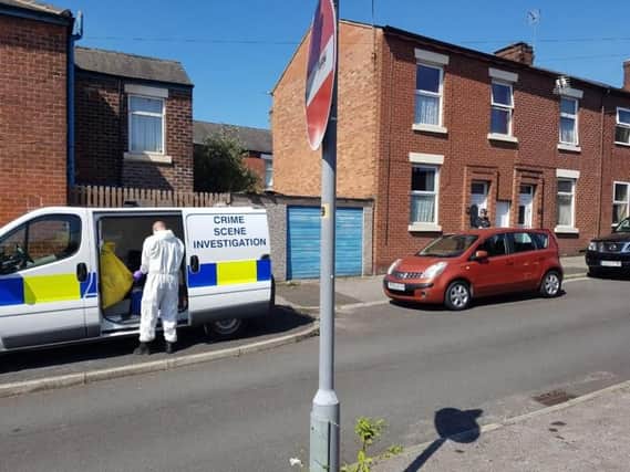 Police on Inkerman Street, in Preston, investigating the suspected murder of a woman, 88.