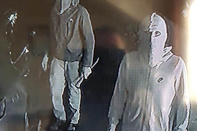 CCTV stills issued by the Lime Bar show masked men