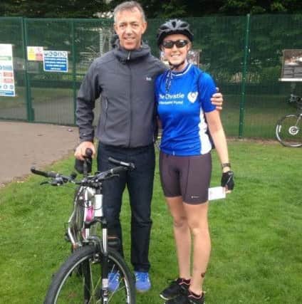 Peter Flynn who was diagnosed with kidney cancer after he went to give blood and a problem was detected
Peter with his daughter Samantha who did a 100 mile bike ride and raised Â£2,500 for The Christie Hospital.