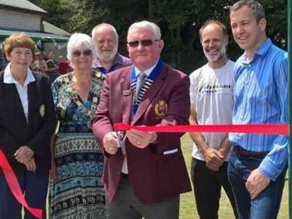 Cutting the ribbon at the opening of the new Crown Green Bowling lawn