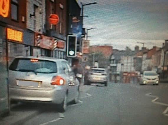 Both cars caught illegally parked (Photo: Lancashire Police).