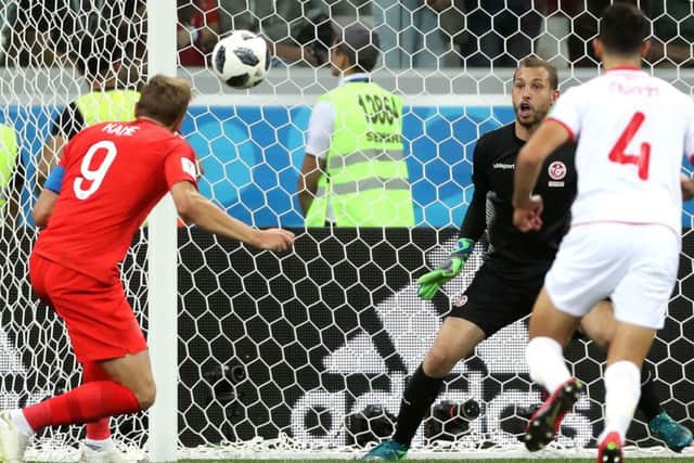 Harry Kane heads home England's winner against Tunisia