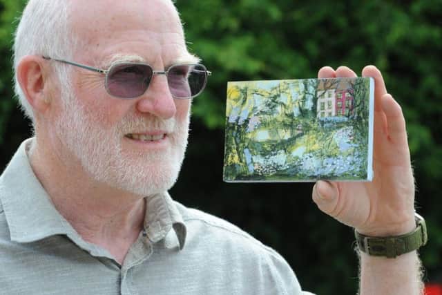 Brian Thomas with work by founder Hazel Titherley