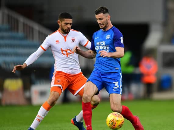 Peterborough left-back Andrew Hughes (right) has been subject of three bids from PNE