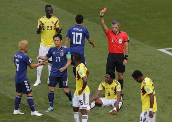 Colombia's Carlos Sanchez is sent off during his teams World Cup group game against Japan