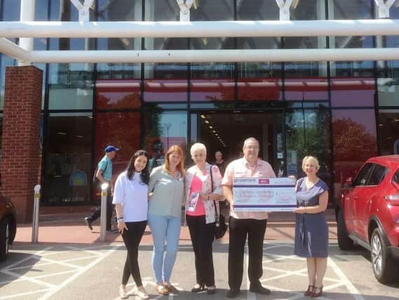 Robin Shaw with colleagues, from the left, Olivia Arden, manager Toni Coley, Vivian Robinson and Rosemere Cancer Foundations Cathy Skidmore