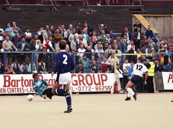 Nigel Greenwood slots home PNE's third goal against Torquay at Deepdale in August 1991