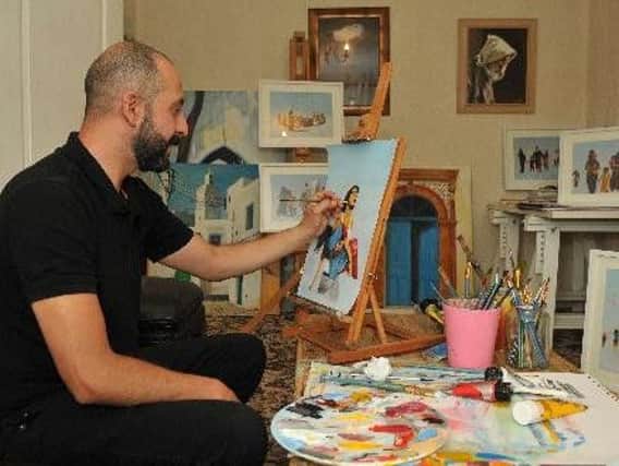 Mohammed Ehlalouch at work at his easel
