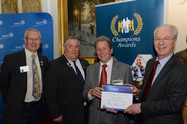 Rotary GBI President Denis Spiller, Cumbria and Lancashire District Governor Larry Branyan, Awardee Norman Yates and NCVO Chair Peter Kellner.