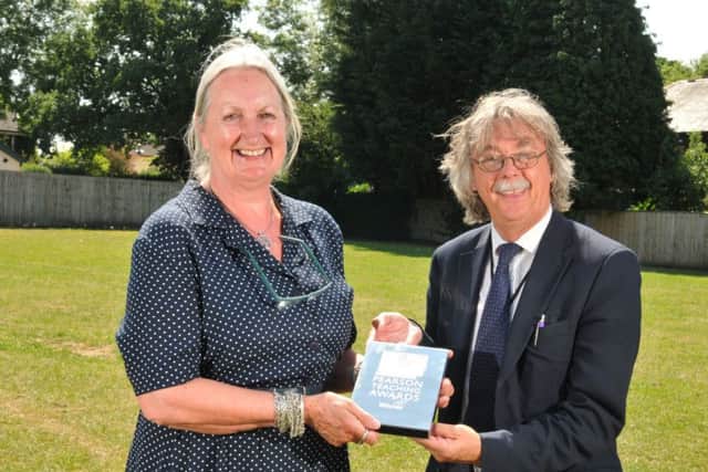 Photo Neil Cross
Moss Side Primary School retiring head Janis Burdin being presented with a Pearson Teaching Silver Lifetime Achievement Award from Jonathan Hewitt