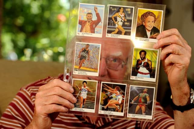Edward Almond with his cigarette card collection