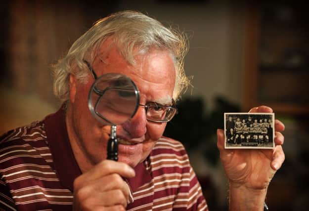 Edward Almond with his cigarette card collection