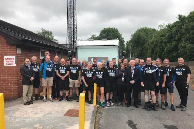 Members of RBS in Preston as they stopped off at Bamber Bridge FC during their 27-mile walk for Prostate Cancer UK