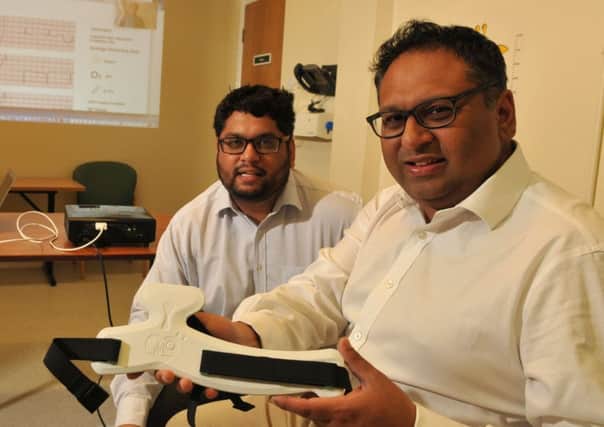 Dr Faheem and Dr Rameen Shakur trialling pioneering heart monitoring equipment at Penwortham St Marys health centre.