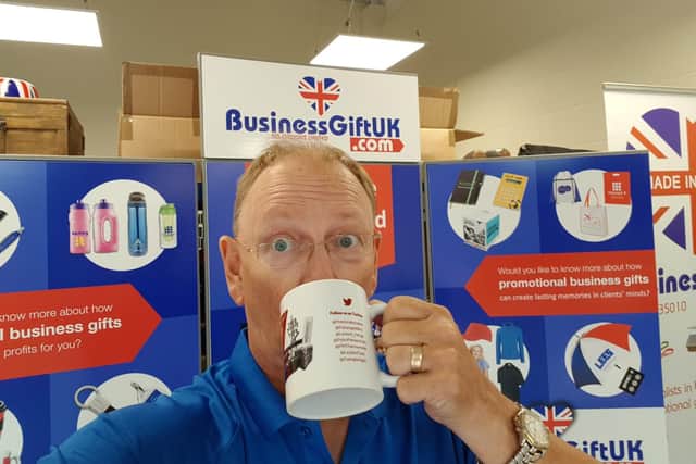 Ad-Options Ltd founder Steve Ward with one of the charity mugs.
