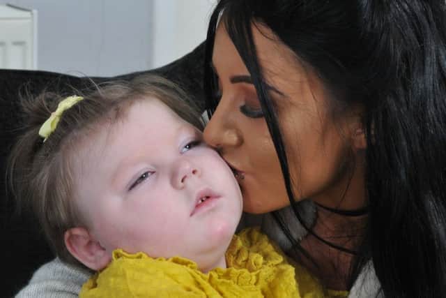 Jenna Heary, 22, and her daughter Olivia, two, who has severe epilepsy which means she has over 100 seizures a day