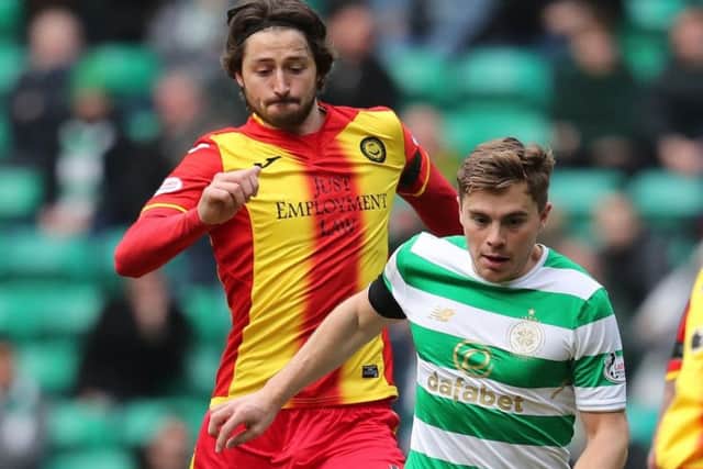 Adam Barton in Partick Thistle colours challenges Celtic's James Forrest
