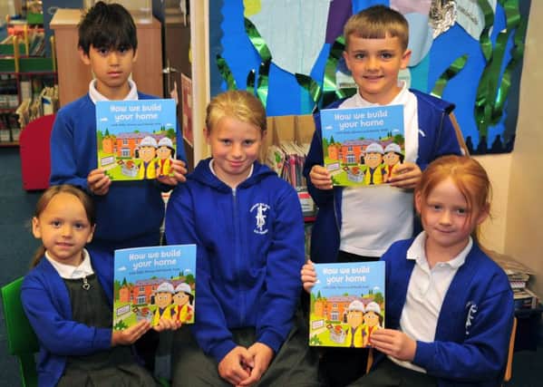 All Saints CE Primary School, in Chorley, has a whole new library  reading materials, thanks to leading homebuilder, Taylor Wimpey Manchester.