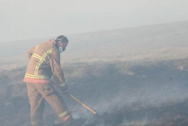 Firefighters have worked in sweltering conditions to keep the fire contained