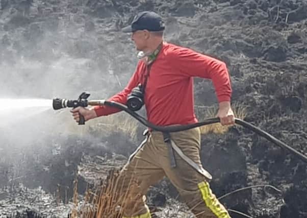 Paul Farman battling the blaze on Winter Hill