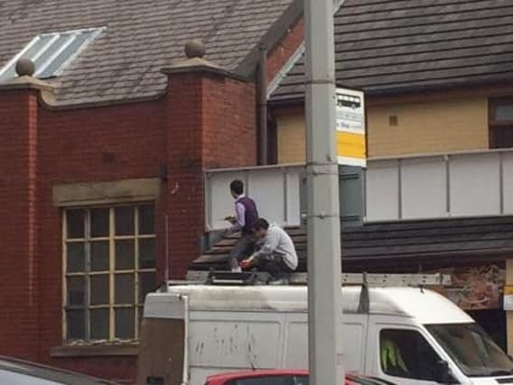 Investigators caught men working at height from a van roof