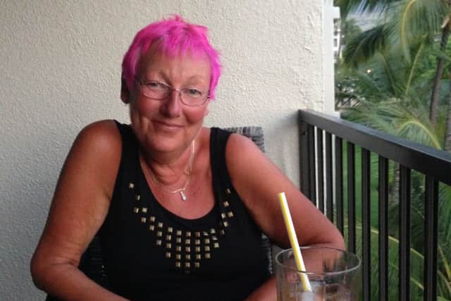 Sue Cogley, who fought breast cancer for 18 years and died at the age of 58 at St Catherine's Hospice. Sue on holiday in Hawaii.