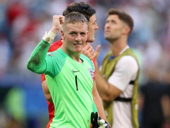 Jordan Pickford celebrates England's win over Sweden