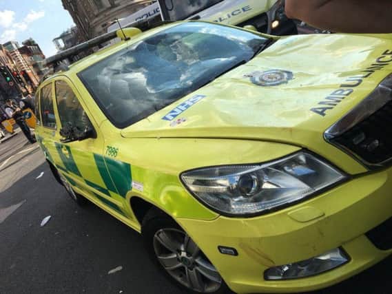 An emergency response car damaged on Borough High Street, London during post match celebrations after the England fotoball team qualified for the semi-final of the World Cup. Picture: London Ambulance Service/PA Wire