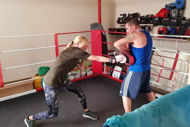 Karen Byrne and husband Arthur doing some boxing training.
Karen, 45, was diagnosed with skin cancer at the age of 30 after spotting a tiny mole which looked strange at the back of her leg and mentioning it to her GP. It ended up being malignant melanoma and she had to have surgery to remove part of her leg.
Since then, she has had 30 moles removed.
Karen worked for the police at the time of her diagnosis but after her skin cancer experience, she decided to follow her dream of becoming a personal trainer and she and Arthur own their own company Bowerham ABC Boxing and Fitness in Lancaster