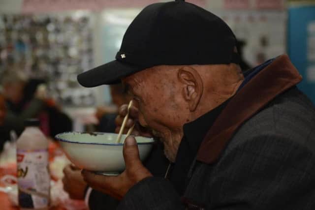 The volunteers serve food thrice weekly