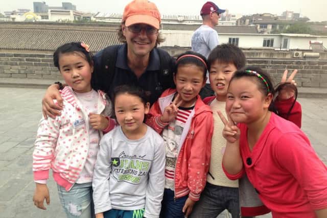 The project also helps serve disadvantaged youngsters - Tony pictured with village children