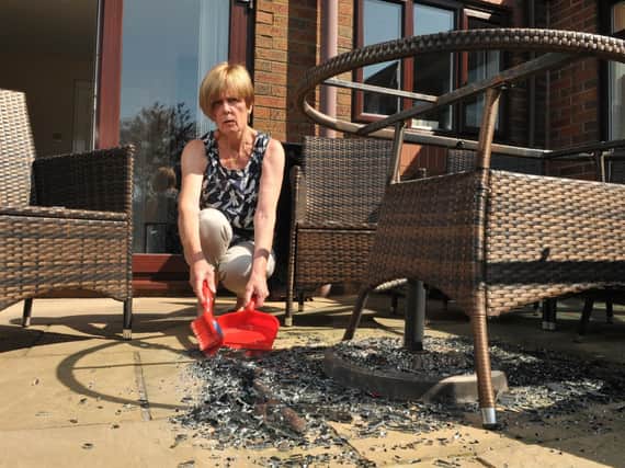 Christine Egerton-Smith's glass garden table exploding in the blistering summer heat (Photos: Neil Cross).