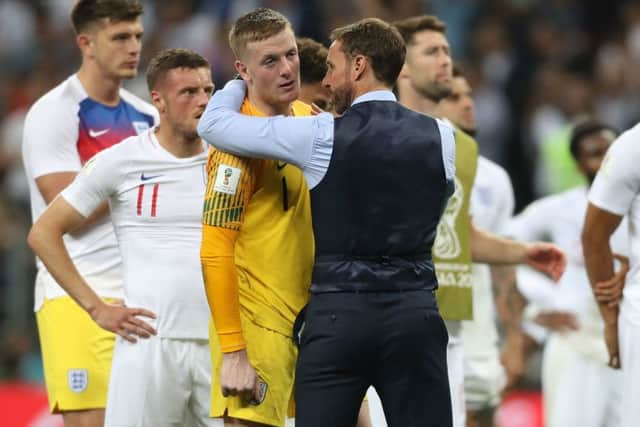 England goalkeeper Jordan Pickford is consoled by England manager Gareth Southgate after losing the FIFA World Cup, Semi Final.