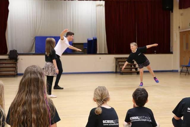 Kieren Spencer teaches his pupils to dance