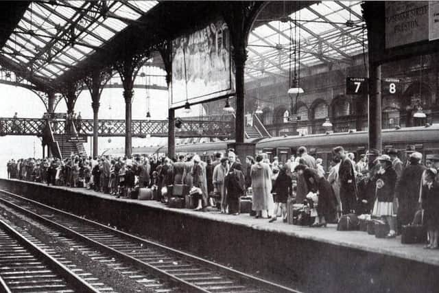 Passengers waiting on Platform 7 of Preston railway station in 1957