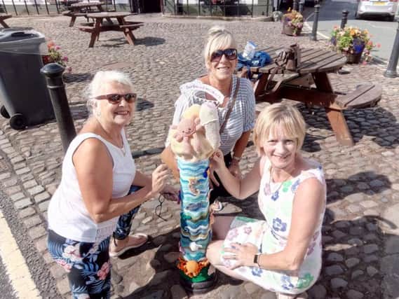 Sally Cowburn, Julie Richardson and April Haxby of the Garstang Hookers crochet group have created an ice cream cone decorated with sea creatures.
