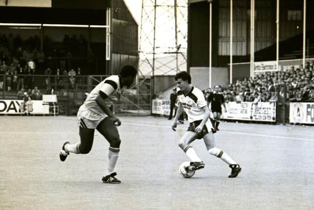 Gary Brazil takes on a Port Vale player