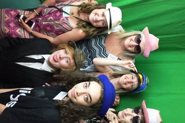 Young people from Lancashire and Barnardo's staff in photo booth