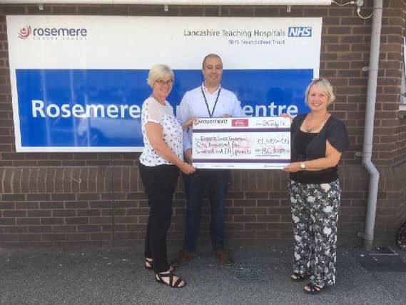HMRCs Preston-based Customer Services Group member  Dan Alvarez, and Marie Hurst, presented a cheque to Cathy Skidmore, Rosemere Cancer Foundations Trust and corporate fund-raising manager.