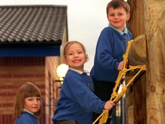 Pictured from left to right are Abbey Brooks, six, Jessica Bevitt, six, and Fabian Towers, seven, playing on the new donated play area at Higher Walton C.E. Primary School, near Preston